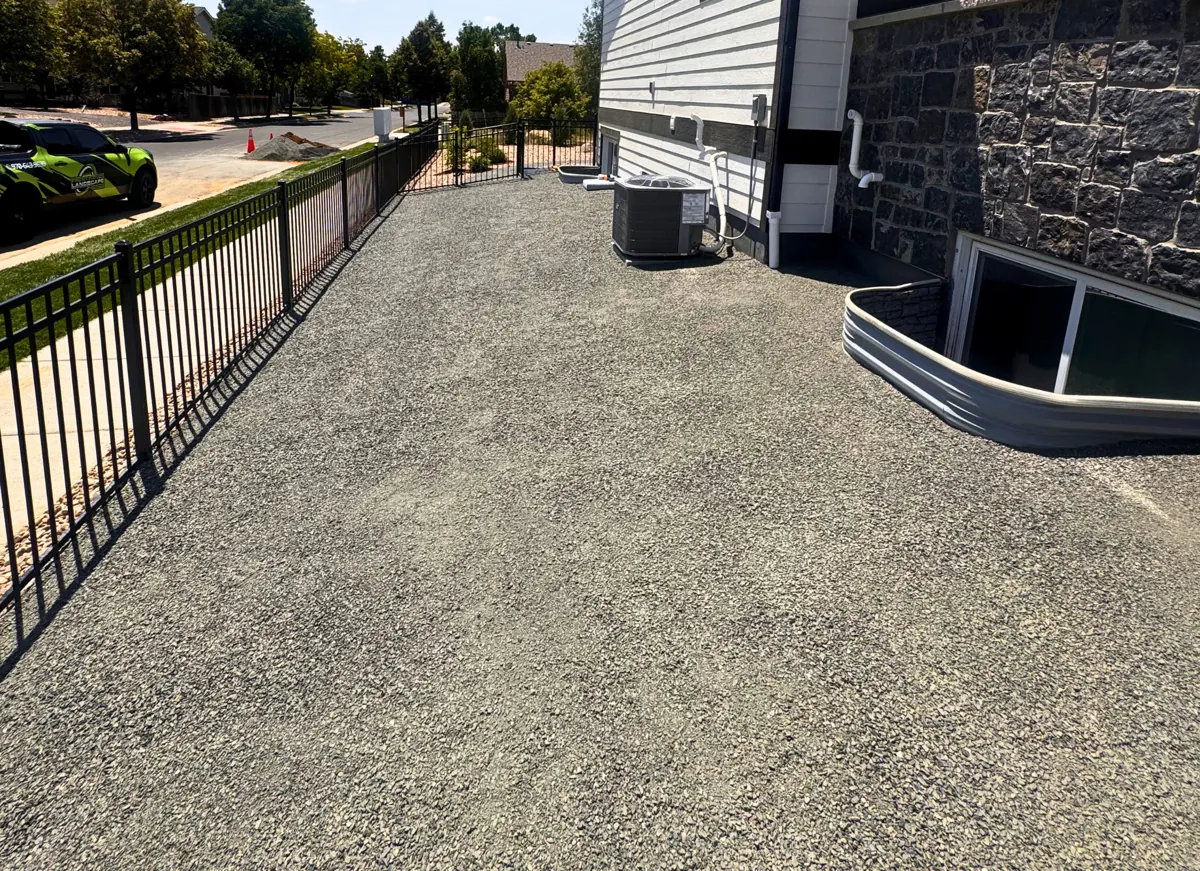 Weedy side yard to a clean gravel run, after