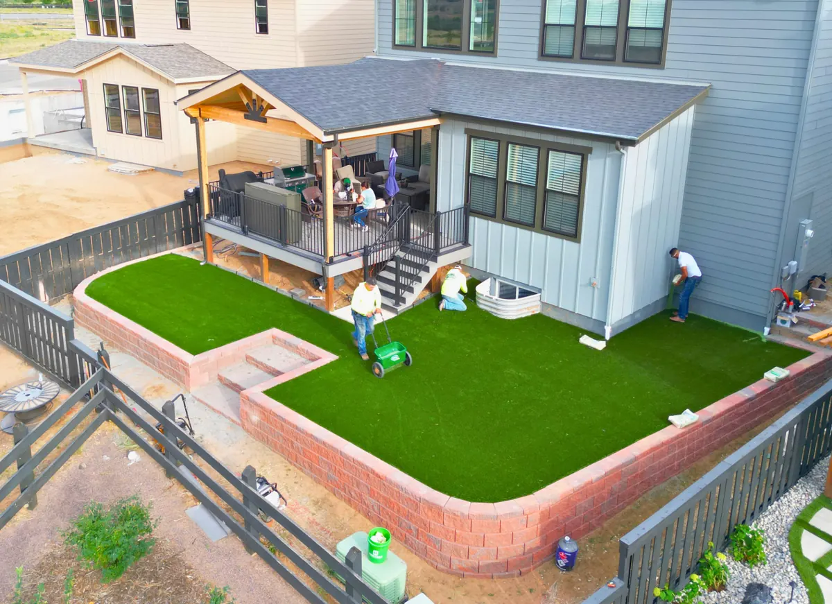 Bare dirt to a turf backyard, after